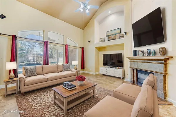 a bedroom with a balcony a bed and a chandelier