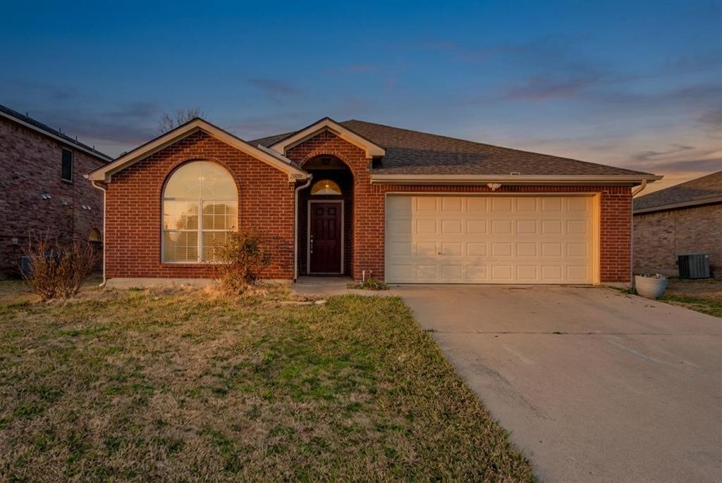 2005 Ridgeview Court Sanger, TX 76266 - Photo 1 of 20 a view of a house with a yard and garage