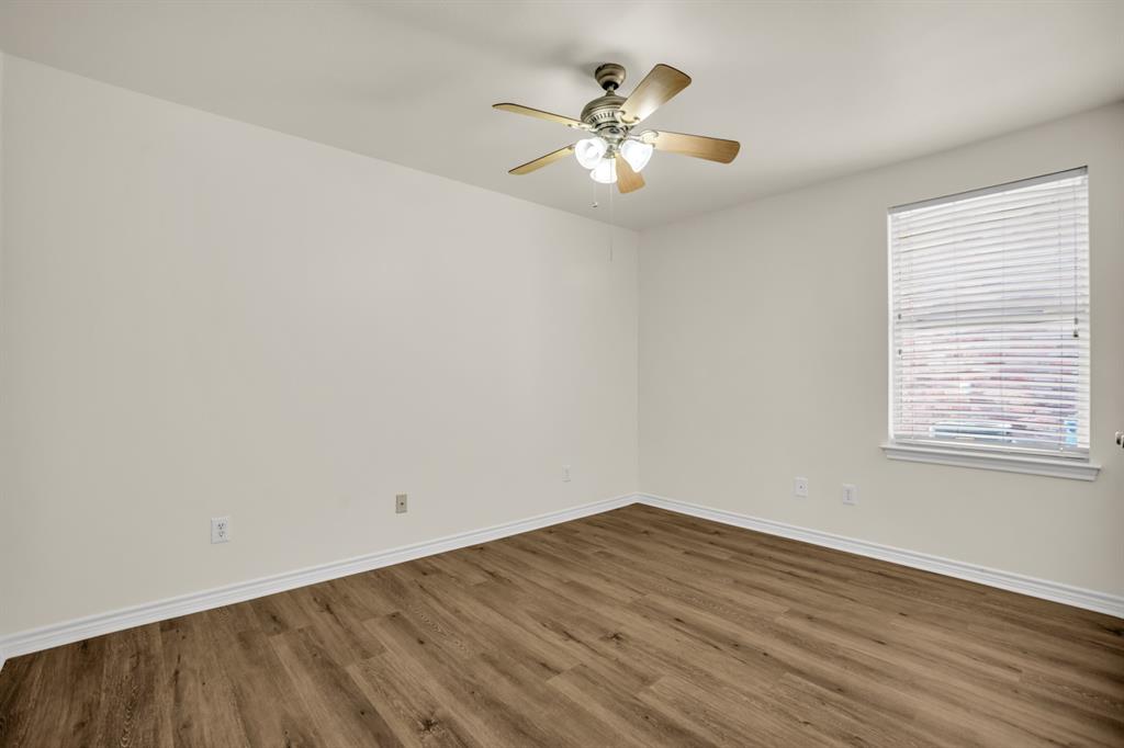 2005 Ridgeview Court Sanger, TX 76266 - Photo 14 of 20 wooden floor in an empty room with a window
