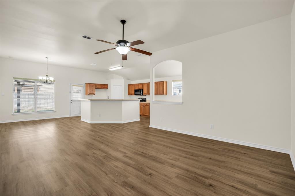 2005 Ridgeview Court Sanger, TX 76266 - Photo 2 of 20 a view of a kitchen with wooden floor and windows