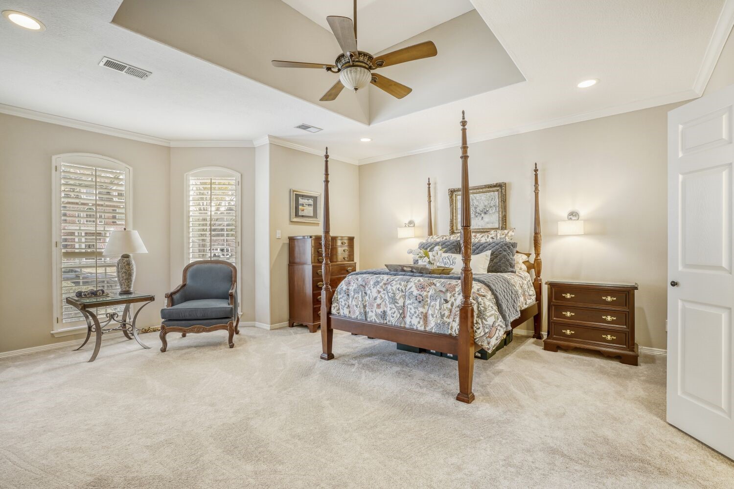 5308 Mountain Grove Court Spring, TX 77379 - Photo 13 of 31 Spacious and elegant primary bedroom with plush carpeting, high ceilings and two large windows with shutters, bathing the room in abundant natural light.