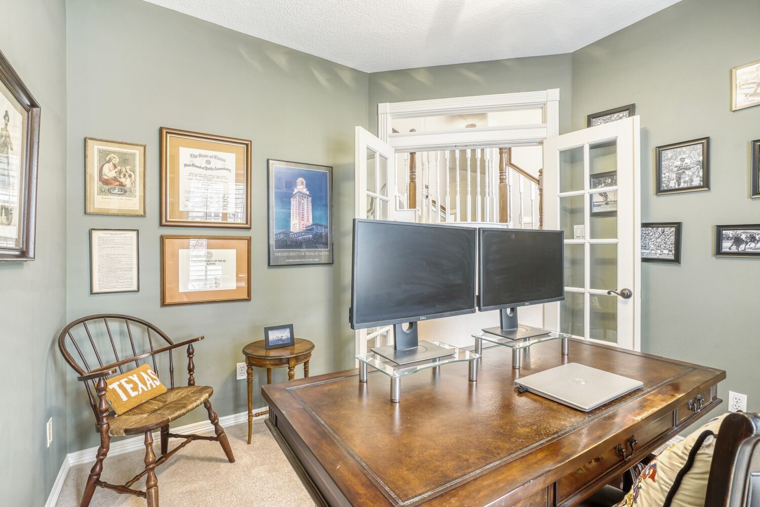 5308 Mountain Grove Court Spring, TX 77379 - Photo 22 of 31 This photo showcases the spacious room with soft green walls. Double glass doors open to a view of a staircase, adding charm and natural light.