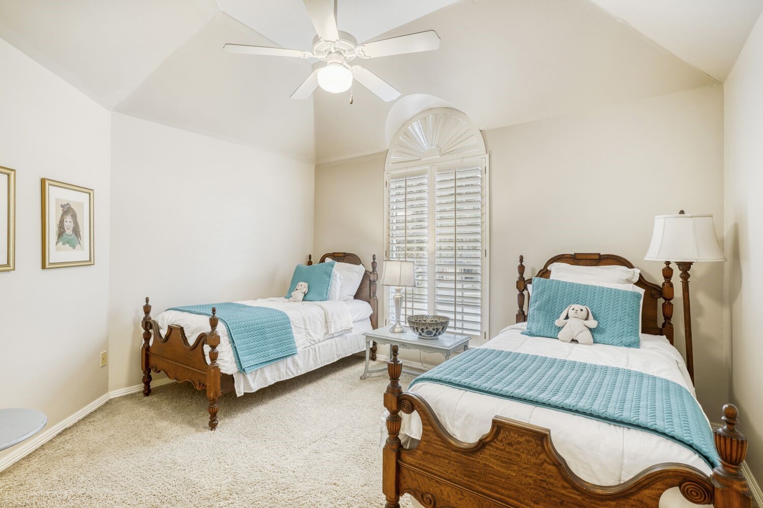 5308 Mountain Grove Court Spring, TX 77379 - Photo 26 of 31 This upstairs bedroom features a charming arched window that fills the space with natural light. It shares the well-appointed Jack and Jill bathroom, offering a private yet functional layout.
