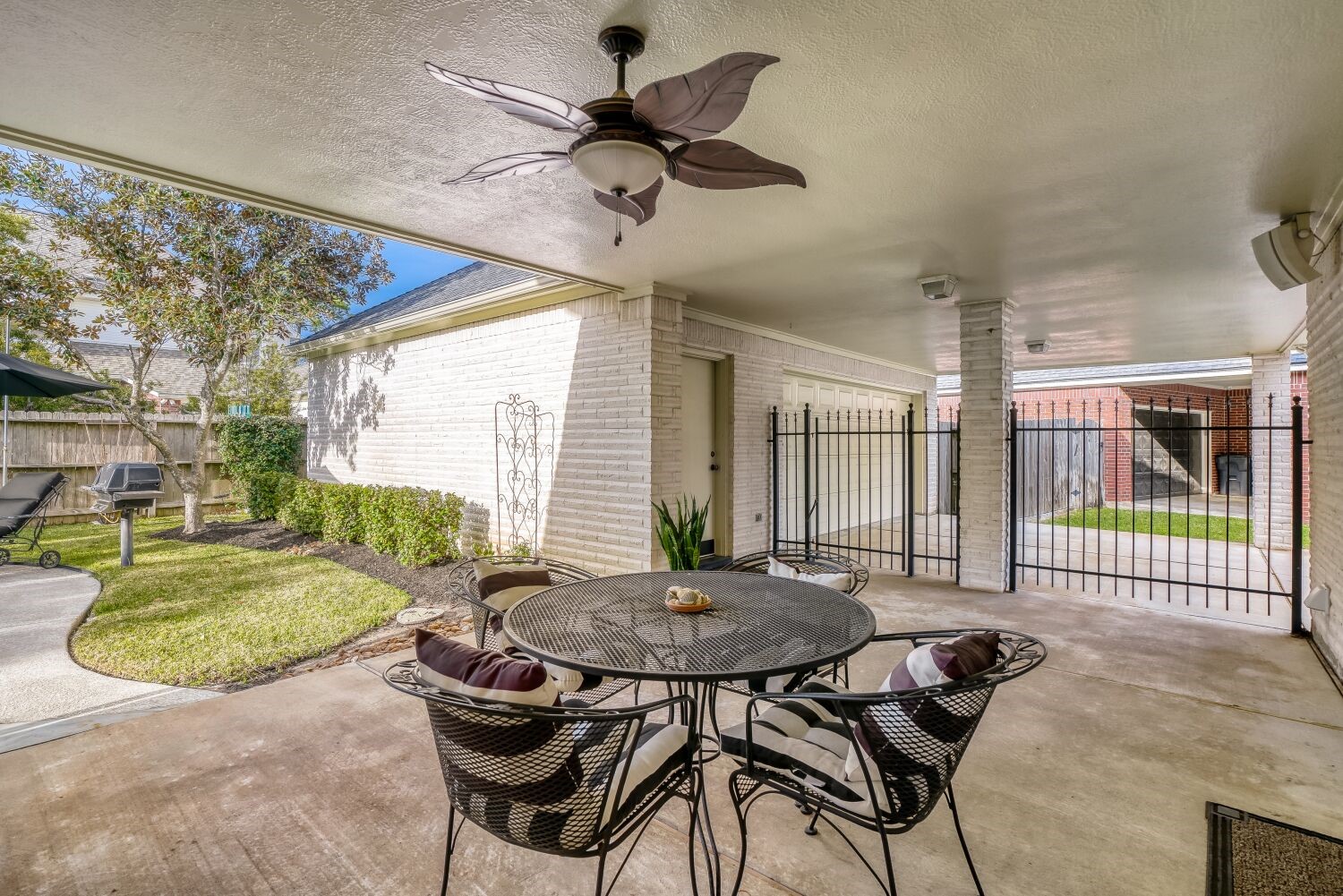 5308 Mountain Grove Court Spring, TX 77379 - Photo 6 of 31 The covered patio, adjoins the 2-car porte-cochère and oversized garage, creating a comfortable space for dining and relaxation.
