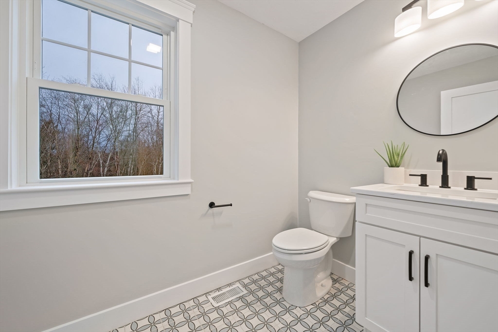 27 Caleb Drive Middleboro, MA 02346 - Photo 15 of 42 a bathroom with a toilet a sink and a mirror