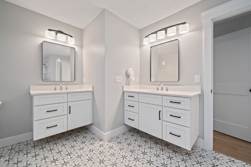 27 Caleb Drive Middleboro, MA 02346 - Photo 22 of 42 a bathroom with a sink vanity and mirror