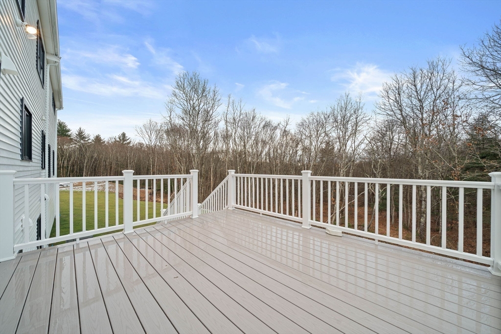 27 Caleb Drive Middleboro, MA 02346 - Photo 34 of 42 a balcony with view of trees in the background