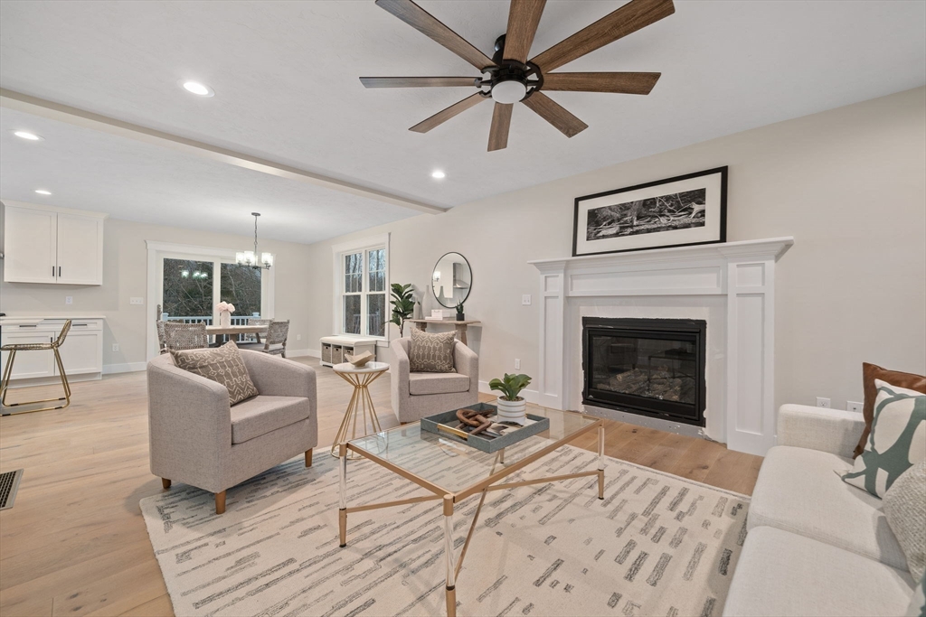 27 Caleb Drive Middleboro, MA 02346 - Photo 10 of 42 a living room with furniture and a fireplace