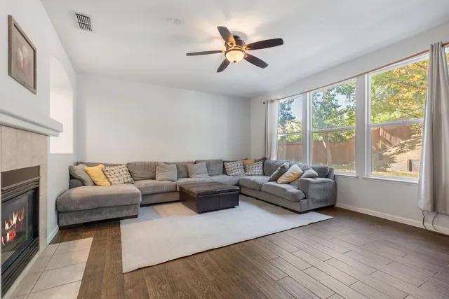 a living room with furniture and a large window