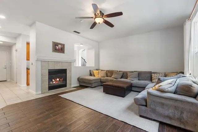 a living room with furniture and a fireplace