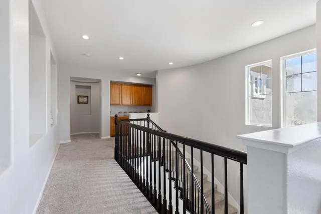 a view of hallway with windows