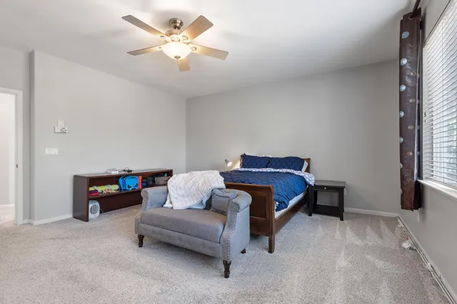 a bedroom with a bed and a couch