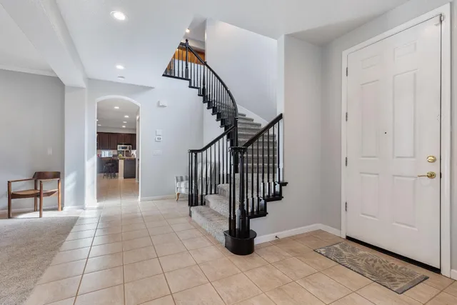 a view of entryway and hall with a rug