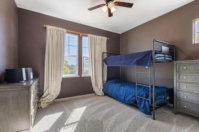 a bedroom with a bed and window