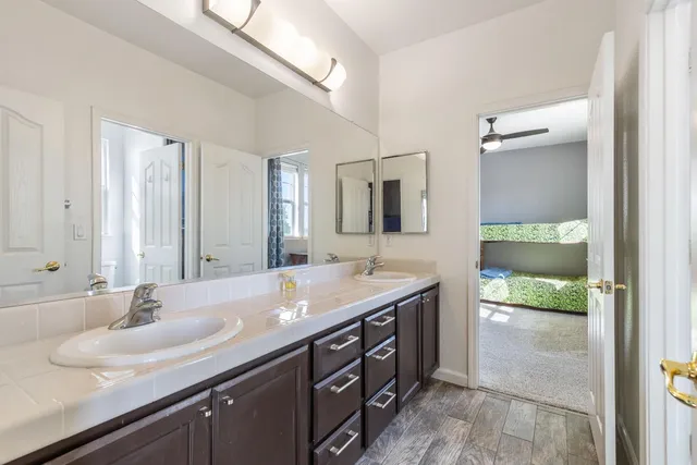 a white toilet sitting next to a bathroom sink