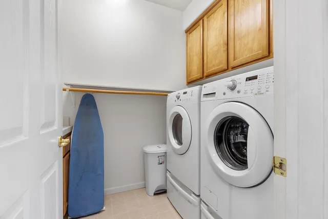 a living room with furniture a large window and a flat screen tv