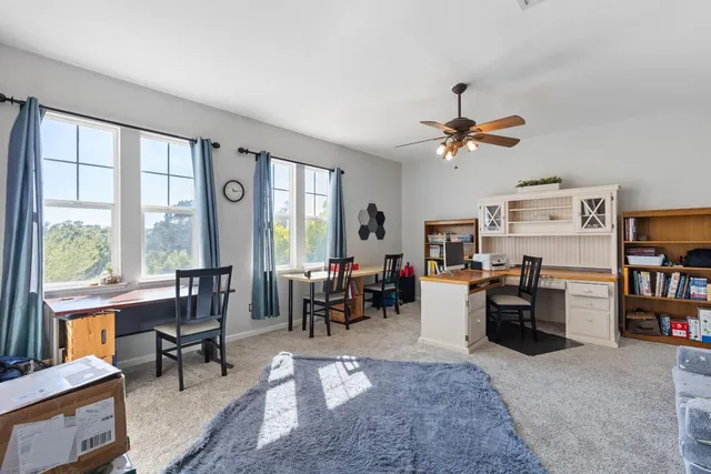 a bedroom with a bed and a book shelf
