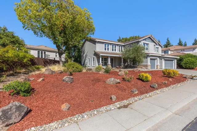 a swimming pool with outdoor seating and yard