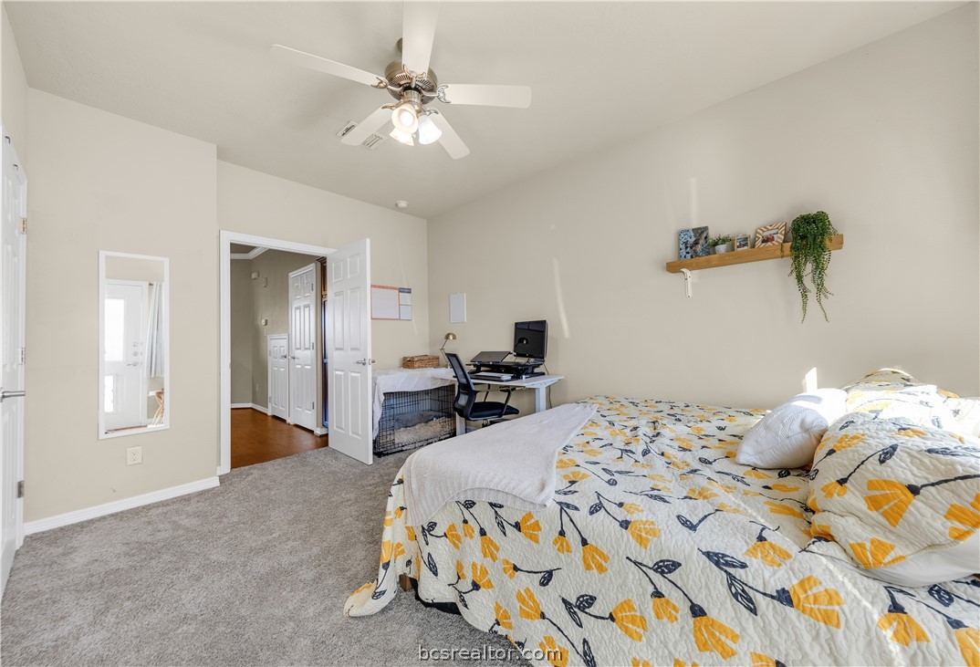 1198 Jones-Butler Road, Unit 1403 College Station, TX 77840 - Photo 10 of 20 a bedroom with a bed and ceiling fan
