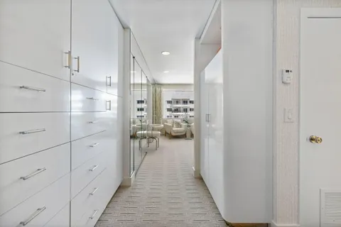 a view of a hallway view with staircase