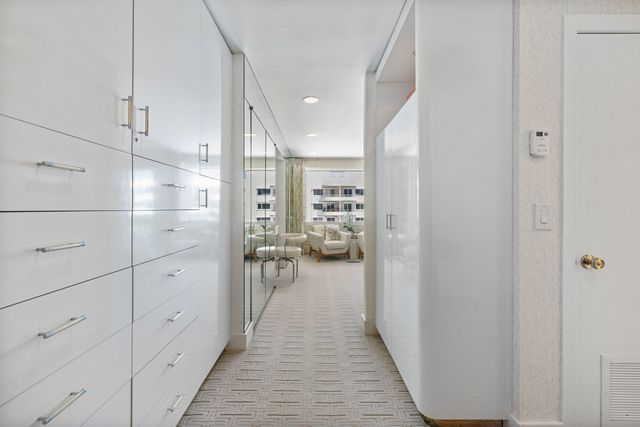 a view of a hallway view with staircase