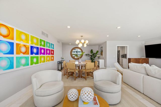 a living room with furniture a rug and a fireplace