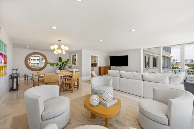 a living room with furniture a rug and a fireplace