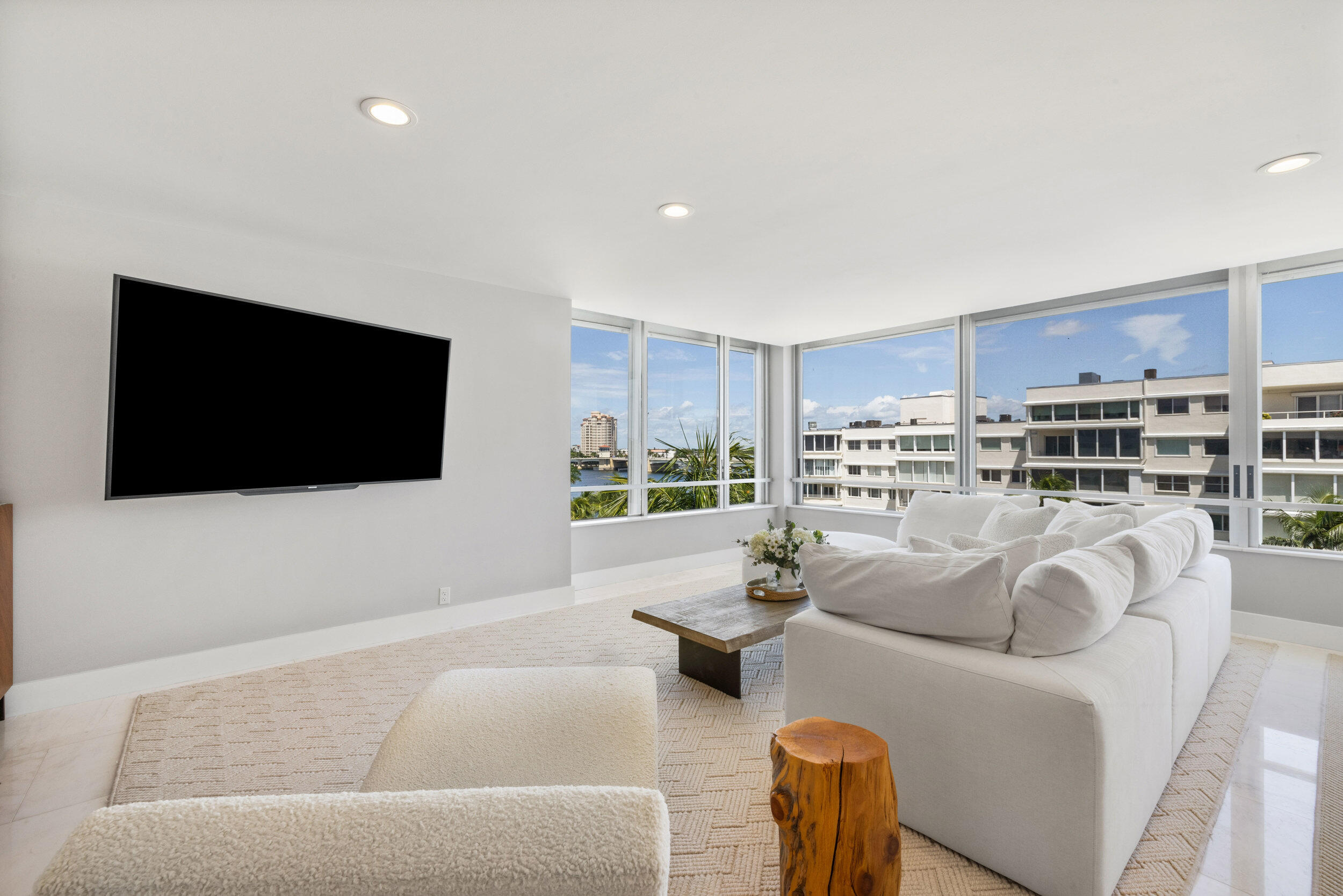 44 Cocoanut Row, Unit 510/511 B Palm Beach, FL 33480 - Photo 7 of 24 a living room with furniture and a flat screen tv