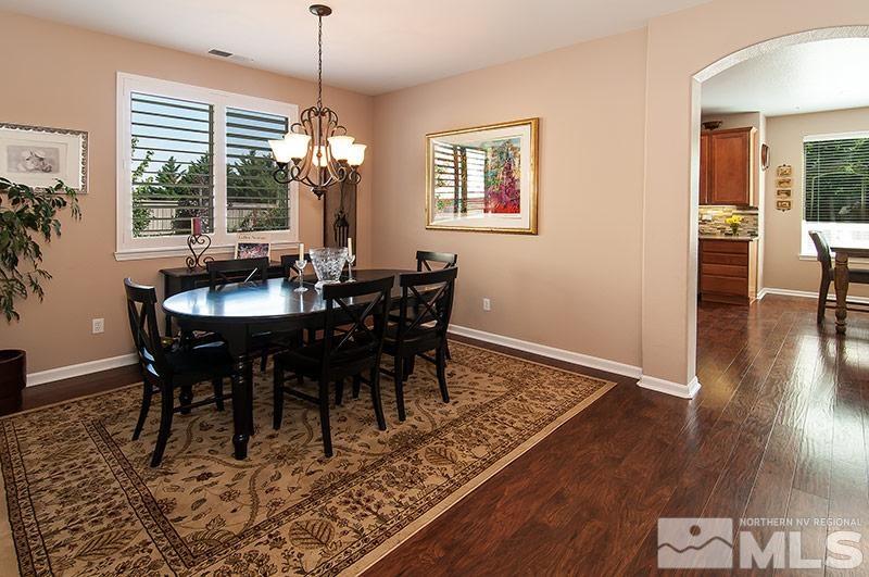 585 Magistrate Court Reno, NV 89521 - Photo 4 of 22 a view of a dining room with furniture window and wooden floor