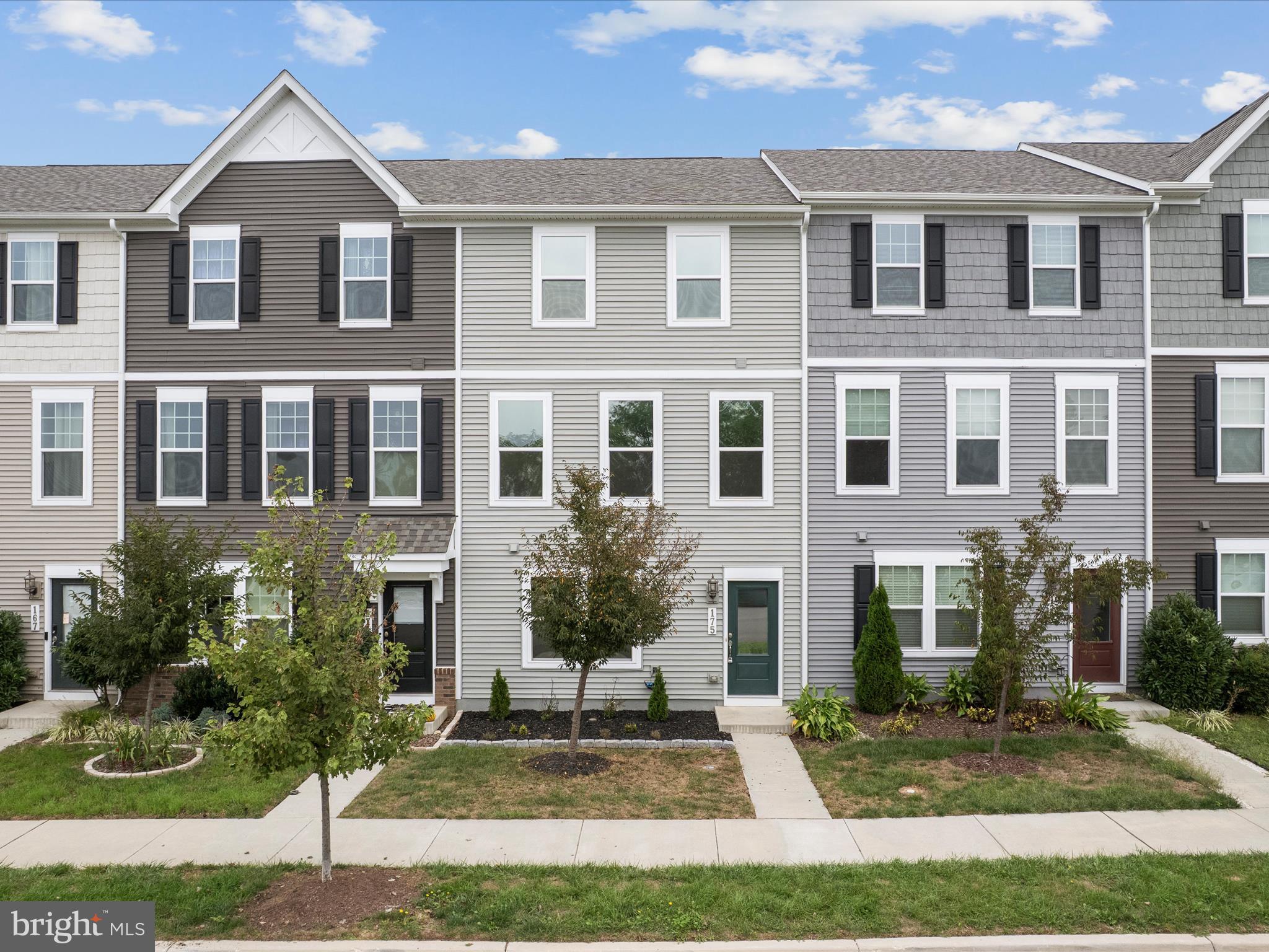 a front view of a house with yard