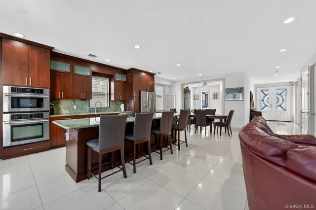 a large kitchen with stainless steel appliances lots of counter space