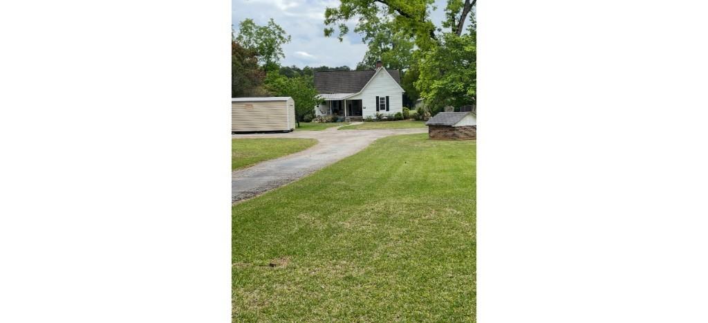 355 Inman Road Hampton, GA 30228 - Photo 1 of 1 a front view of a house with a yard