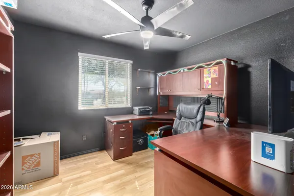 a work room with furniture and a window