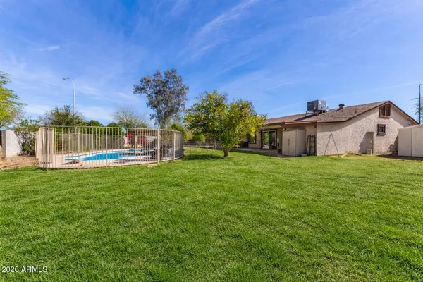 a view of a house with a yard