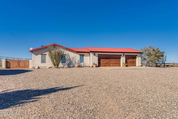 a living room with furniture and a ceiling fan