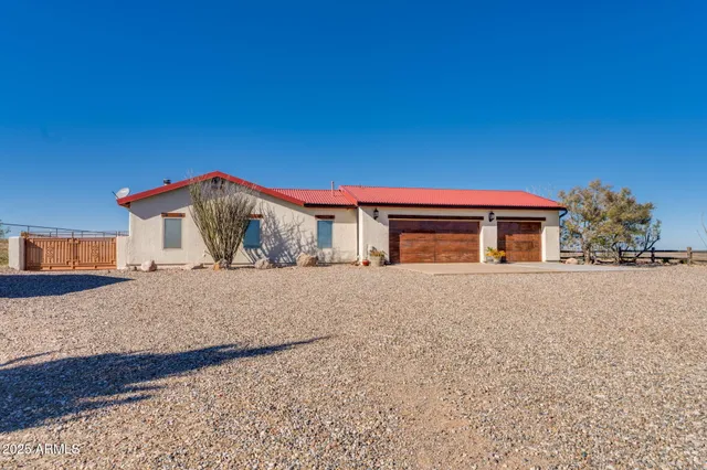 a living room with furniture and a ceiling fan