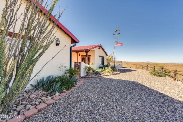 a kitchen with stainless steel appliances granite countertop a stove a sink a oven a dining table and chairs