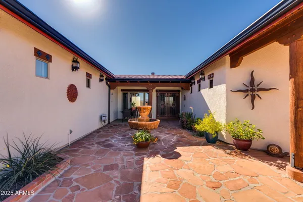 a kitchen with stainless steel appliances granite countertop a stove and a wooden floor