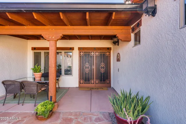 a bedroom with a bed a mirror and a window