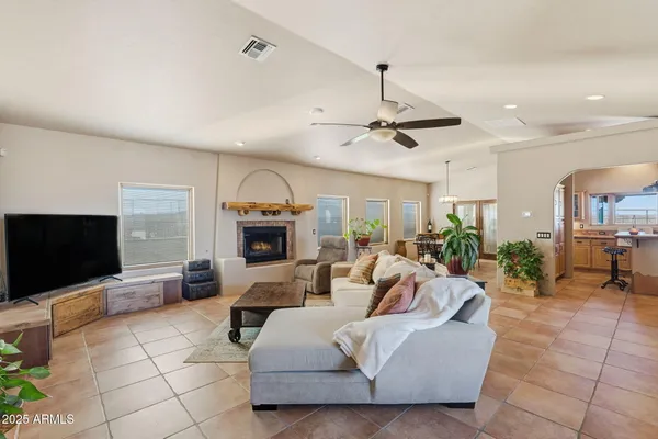 a dining room with furniture and a rug