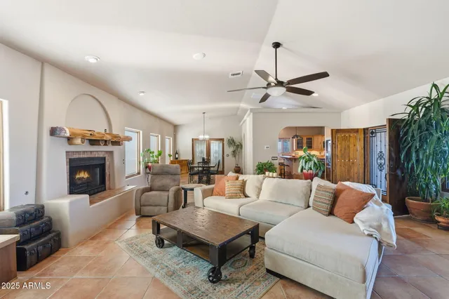 a dining room with furniture and floor to ceiling window