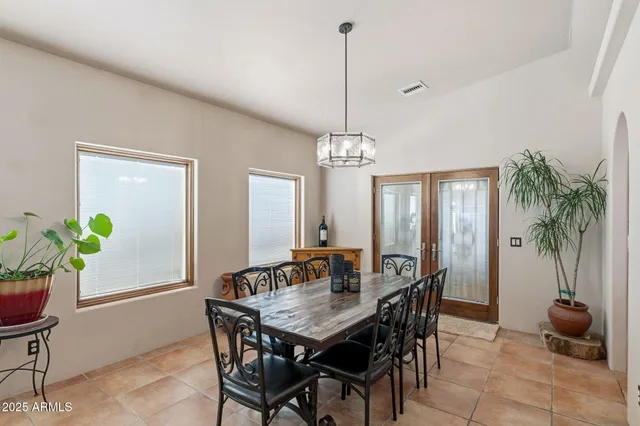 a view of a house with backyard sitting area and garden