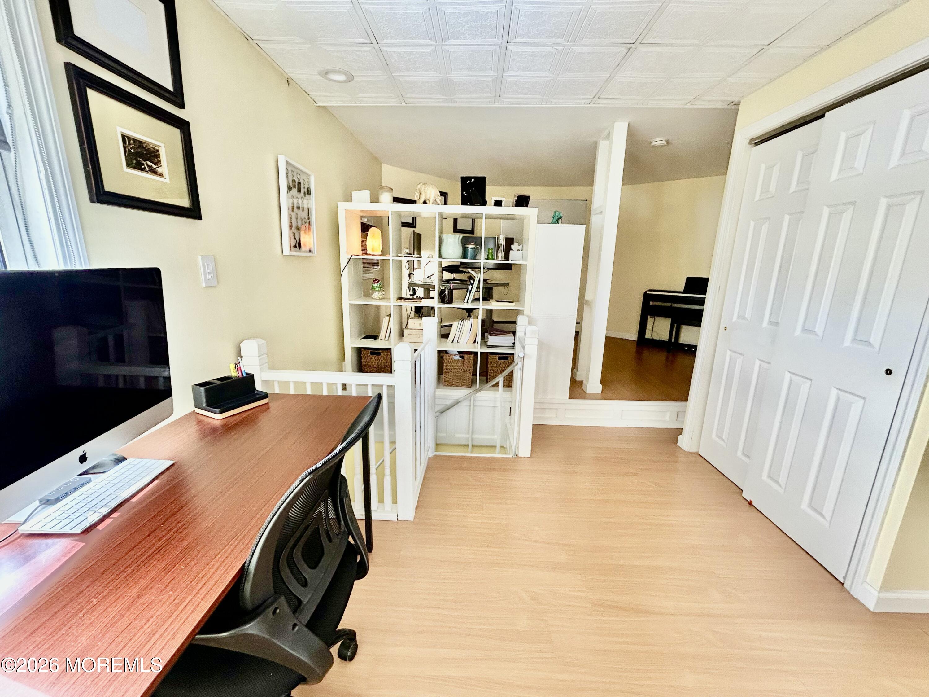 109 Poole Avenue Union Beach, NJ 07735 - Photo 22 of 23 a view of a kitchen with fridge and wooden floor