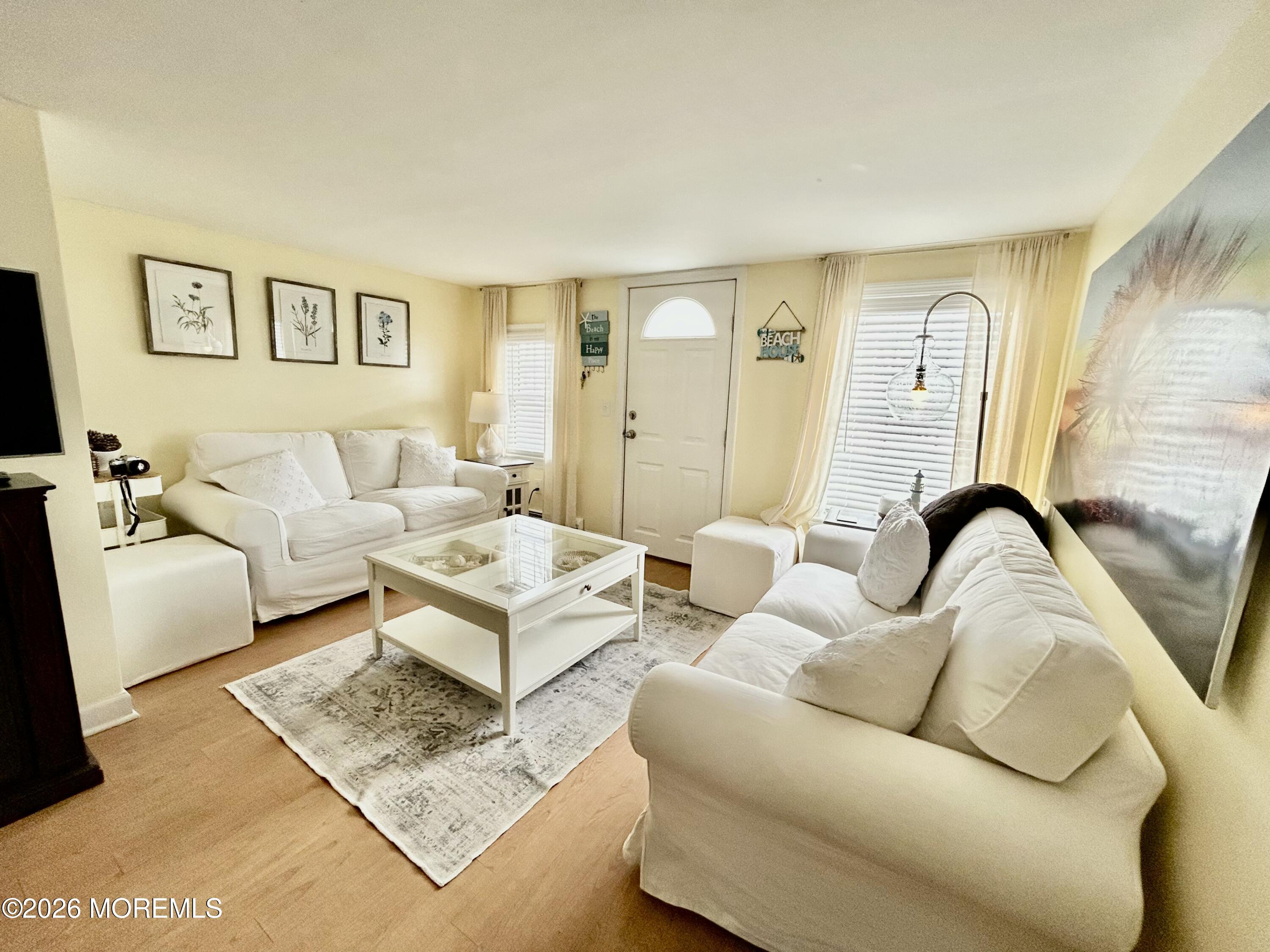 109 Poole Avenue Union Beach, NJ 07735 - Photo 4 of 23 a living room with furniture and a rug