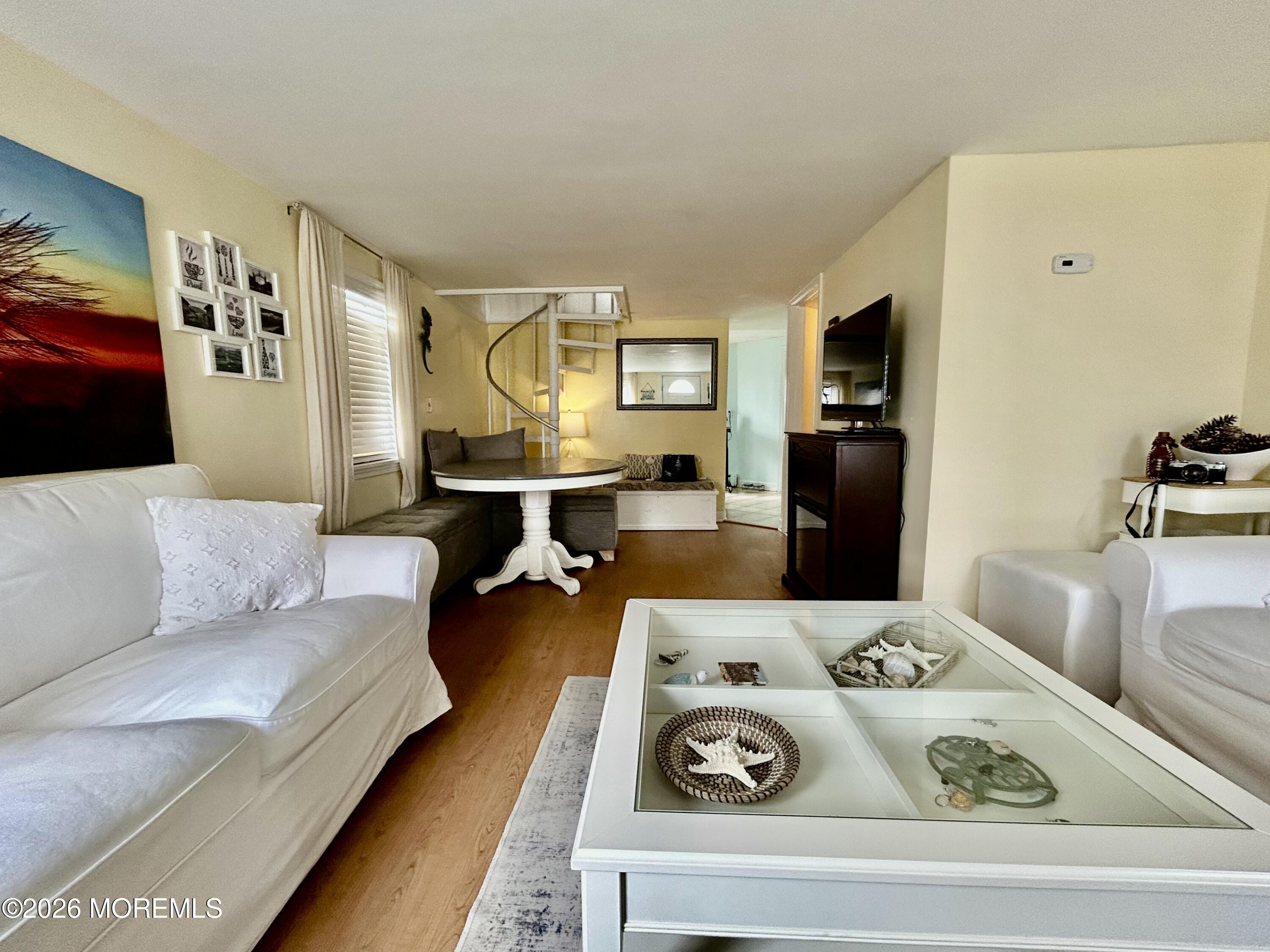 109 Poole Avenue Union Beach, NJ 07735 - Photo 6 of 23 a living room with furniture and a flat screen tv