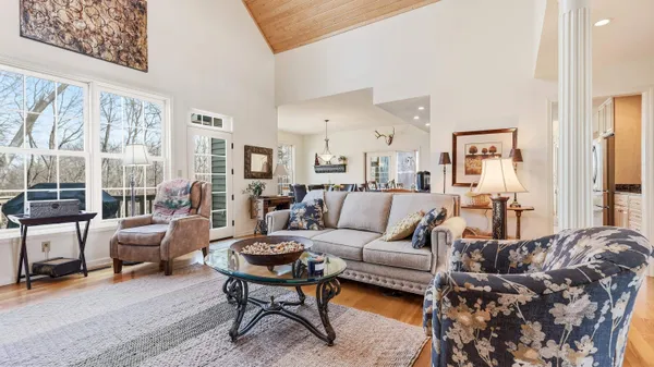 a living room with furniture or couch and a large window