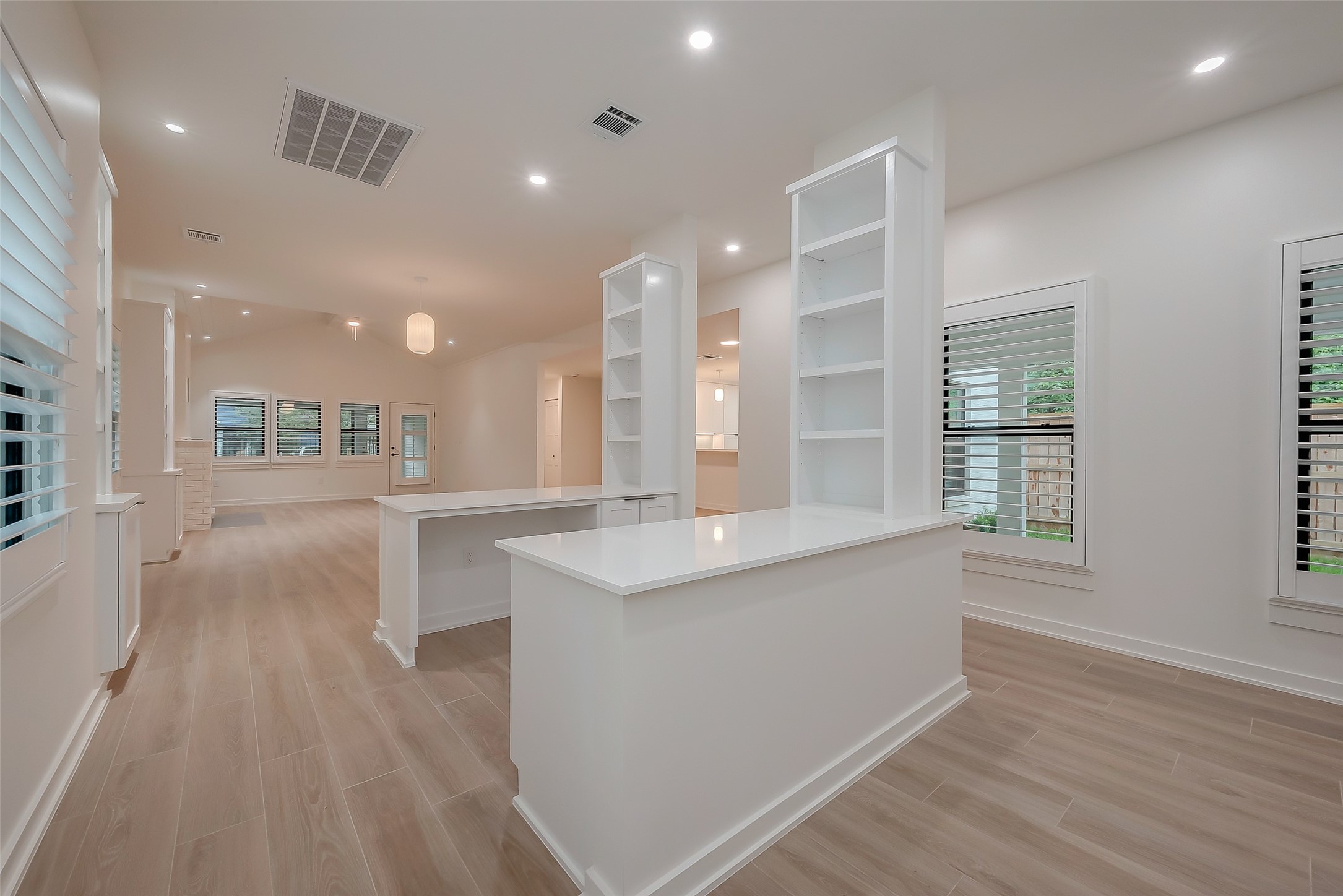 2702 Delano Street Houston, TX 77004 - Photo 12 of 45 a large kitchen with stainless steel appliances a large counter top a stove and a wooden floors