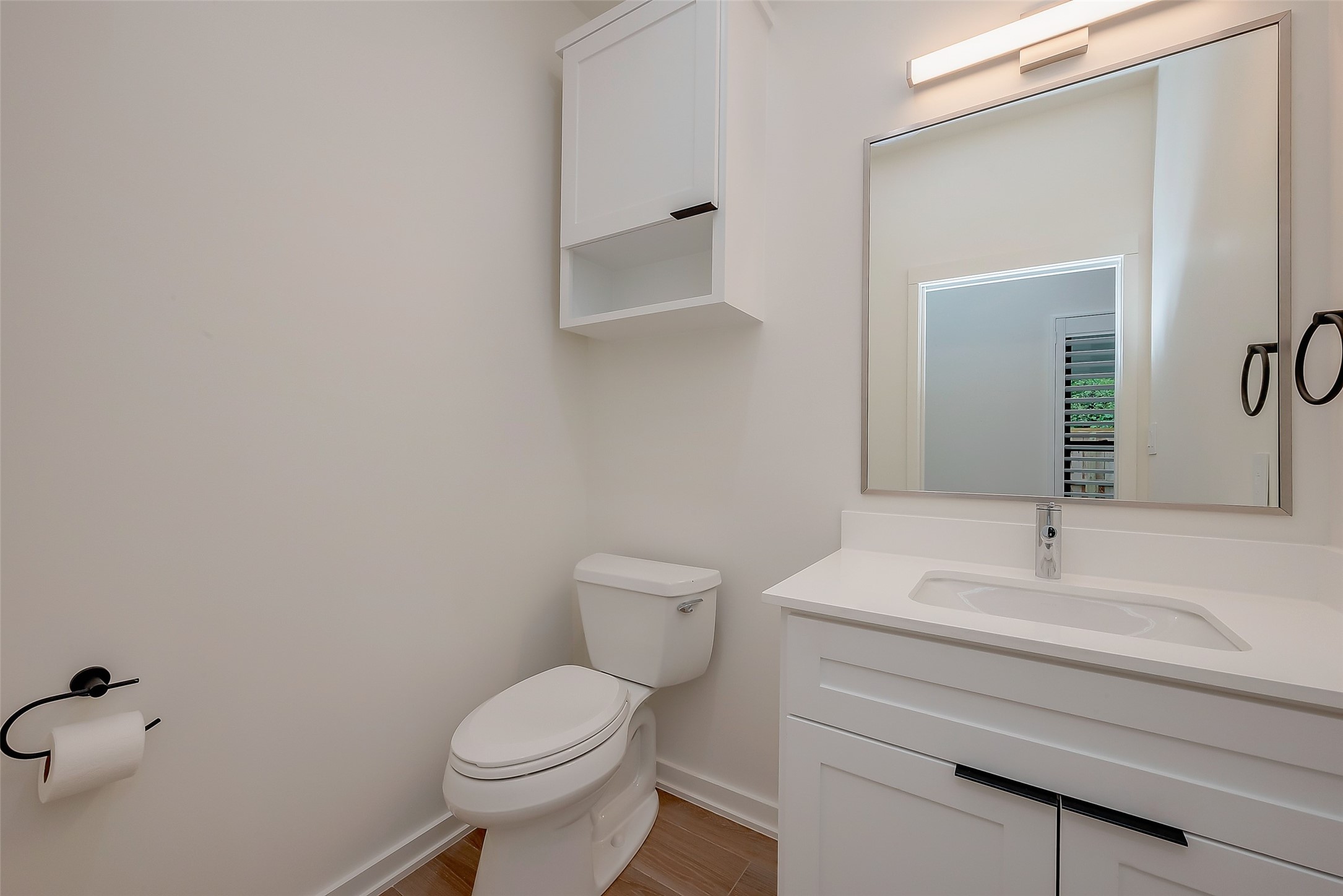 2702 Delano Street Houston, TX 77004 - Photo 15 of 45 a bathroom with a toilet sink and mirror