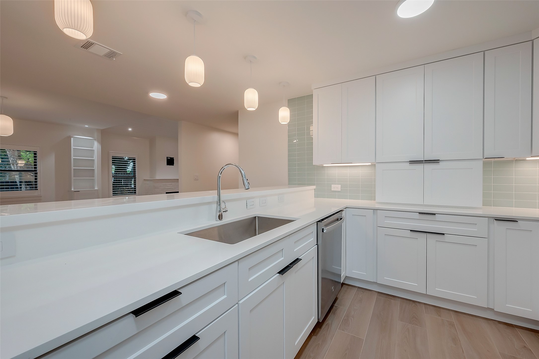 2702 Delano Street Houston, TX 77004 - Photo 22 of 45 a kitchen with a sink and cabinets
