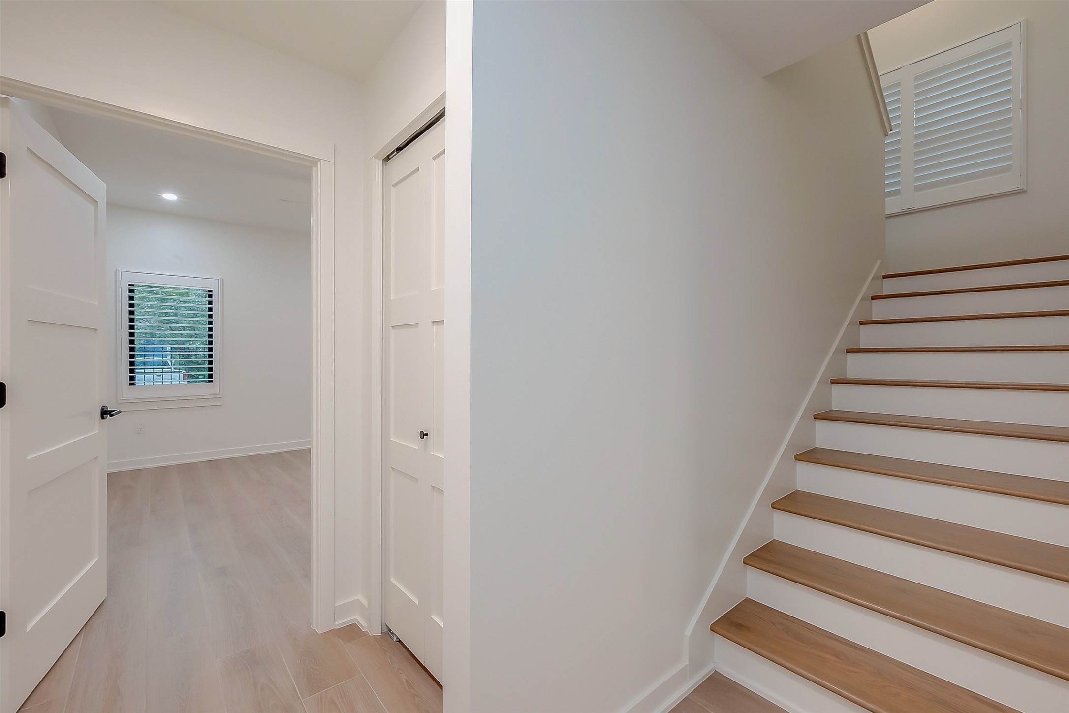 2702 Delano Street Houston, TX 77004 - Photo 24 of 45 a view of entryway with wooden floor and stairs